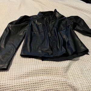 Pleather blouse with tie bow at neck.  super soft. super cute